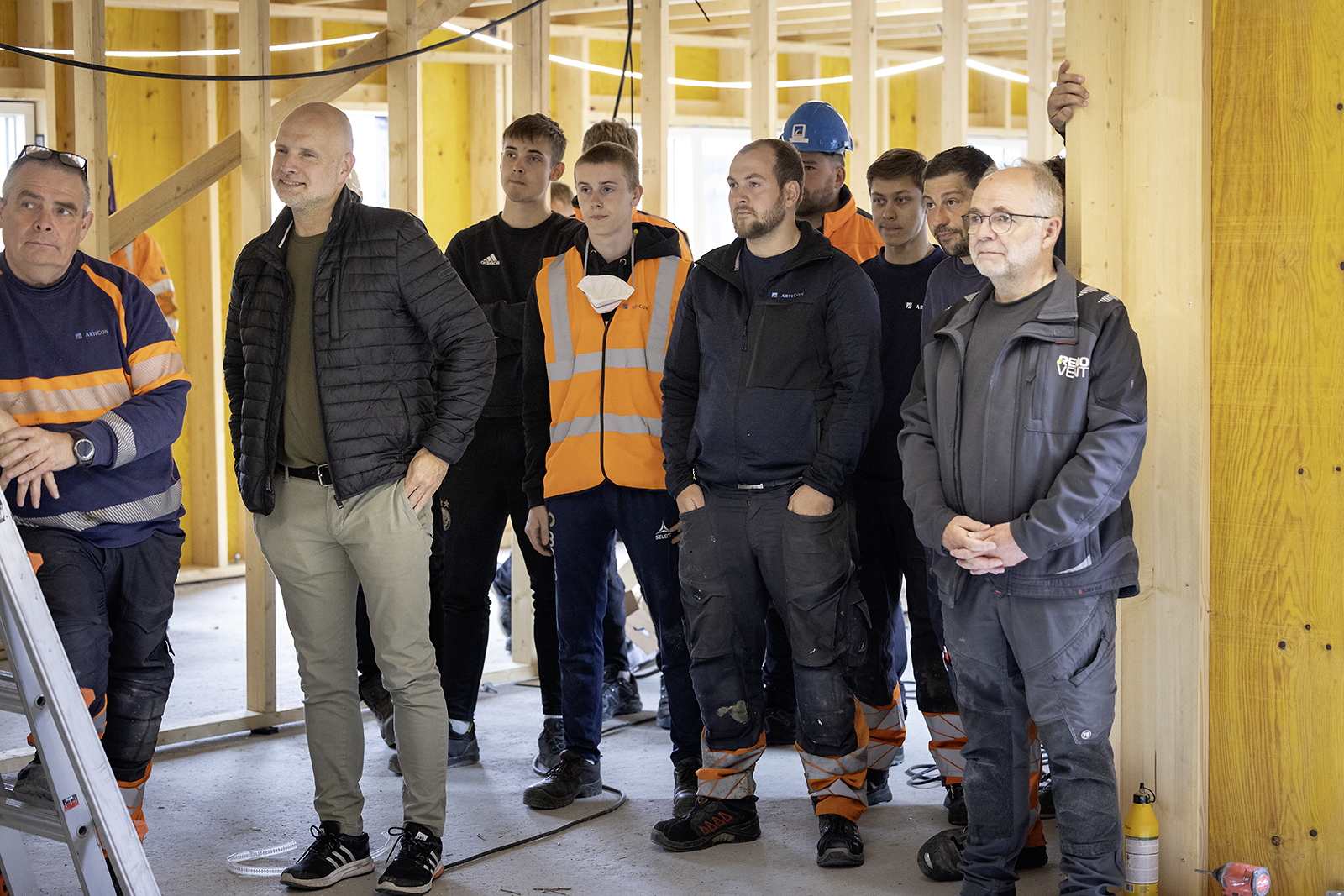 a group of men posing for a photo