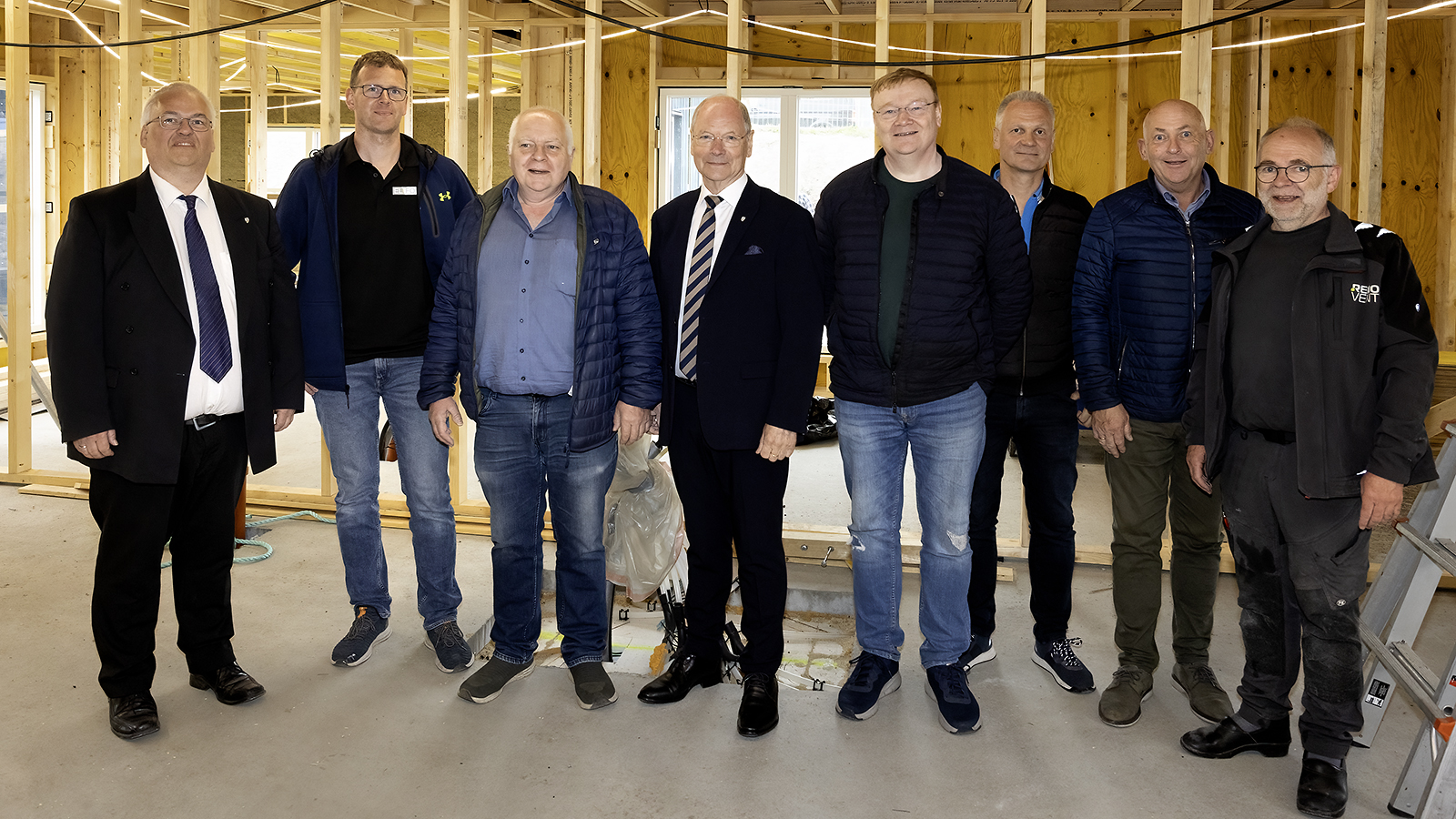 a group of men posing for a photo