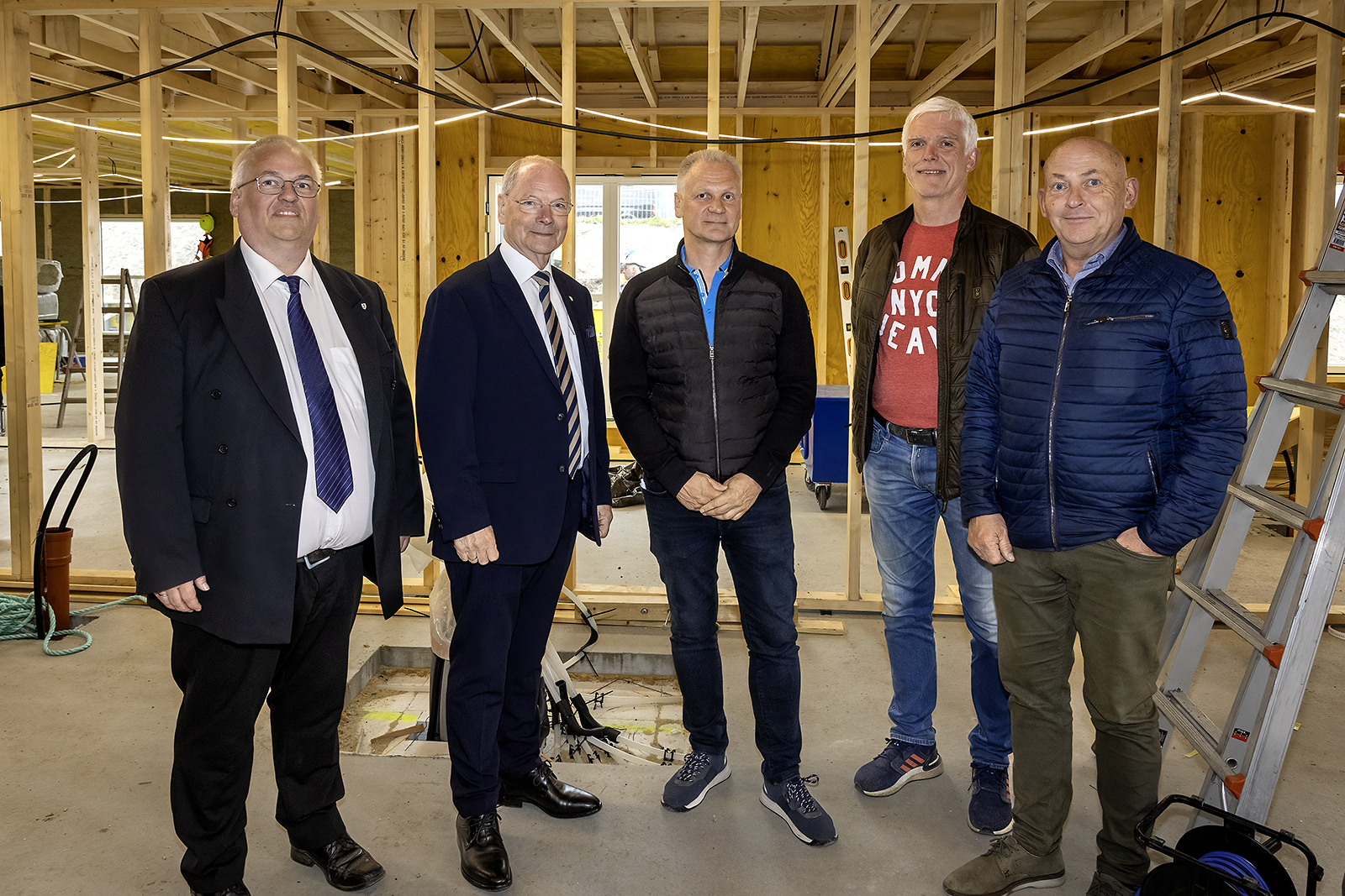 a group of men posing for a photo